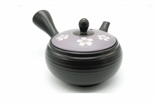 Murasaki Kyusu, a black ribbed Tokoname teapot with a lavender lid of white cherry blossoms, front view