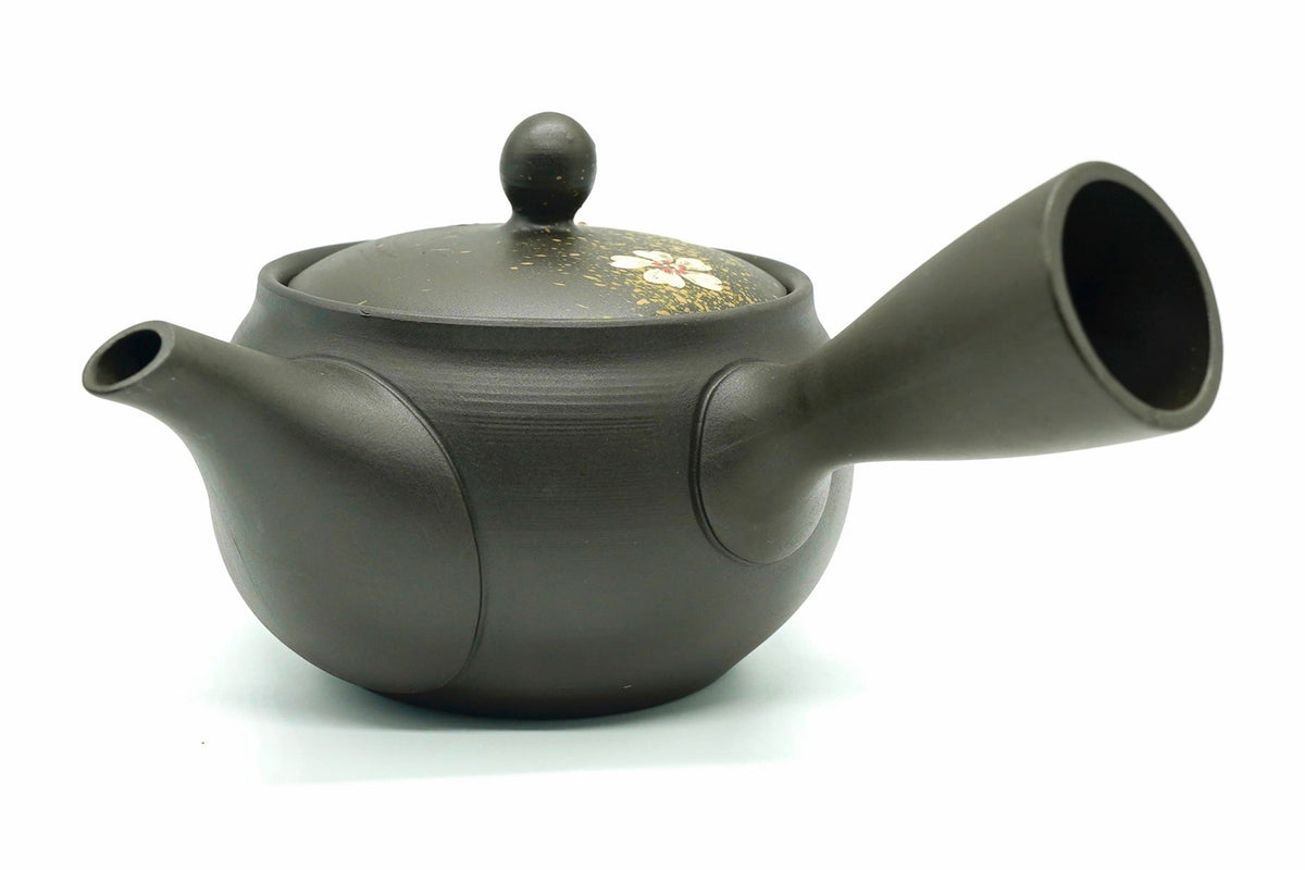 Nadeshiko Kyusu seen from the spout side, gold flecks and a flower on the lid