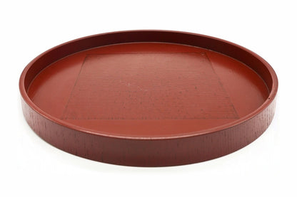 Negoro Maru-bon, a round red tea tray with a low straight rim and a textured square in the centre, seen from the side