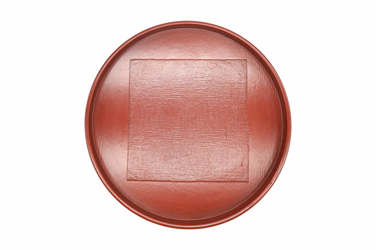 Negoro Maru-bon from above, a round red tea tray with a textured square in the centre
