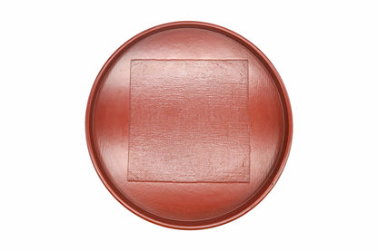Negoro Maru-bon from above, a round red tea tray with a textured square in the centre