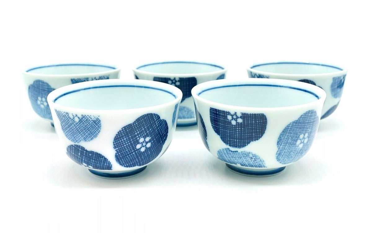 Nunome-Ume Yunomi, five small white teacups with cross-hatched indigo and pale blue plum blossoms