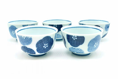 Nunome-Ume Yunomi, five small white teacups with cross-hatched indigo and pale blue plum blossoms