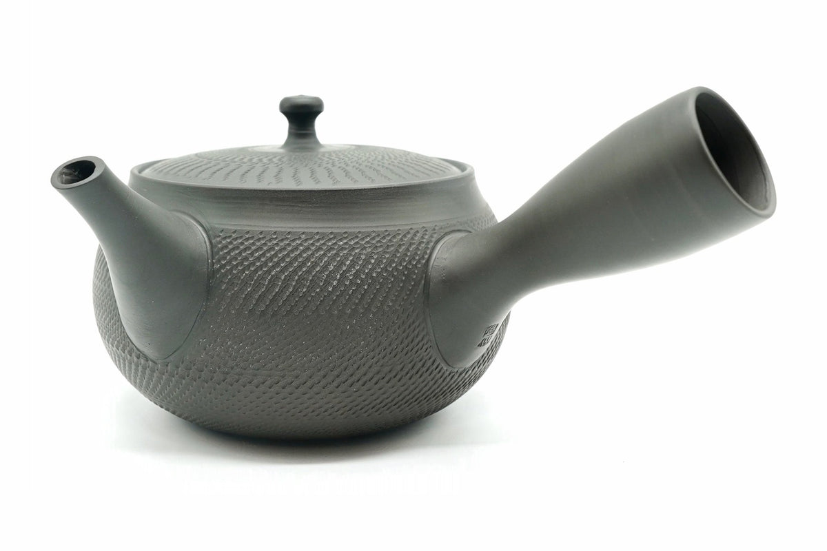 Rikyu Nezumi kyusu, side view, unglazed grey-green clay with fine carved chatter marks over the body and lid