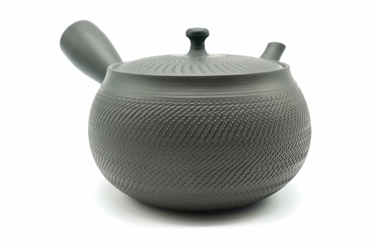 Rikyu Nezumi kyusu from the other side, showing the side handle and the smooth band at the shoulder