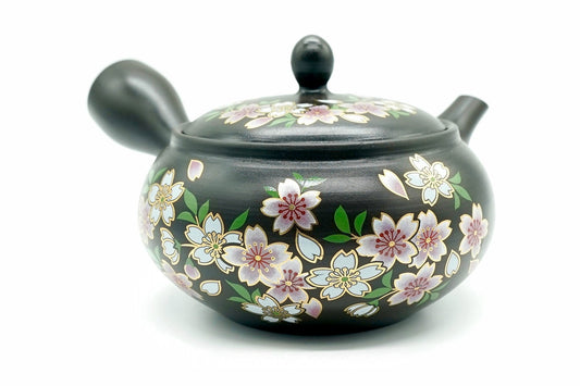 Sakura-Dori Kyusu, a black Tokoname teapot hand-painted with pink, white and blue cherry blossoms outlined in gold, front view