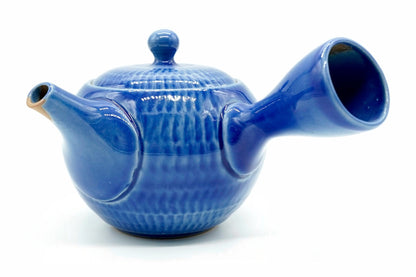 Seigyoku Kyusu, a sapphire-blue Tokoname teapot with rows of chattered marks, side view