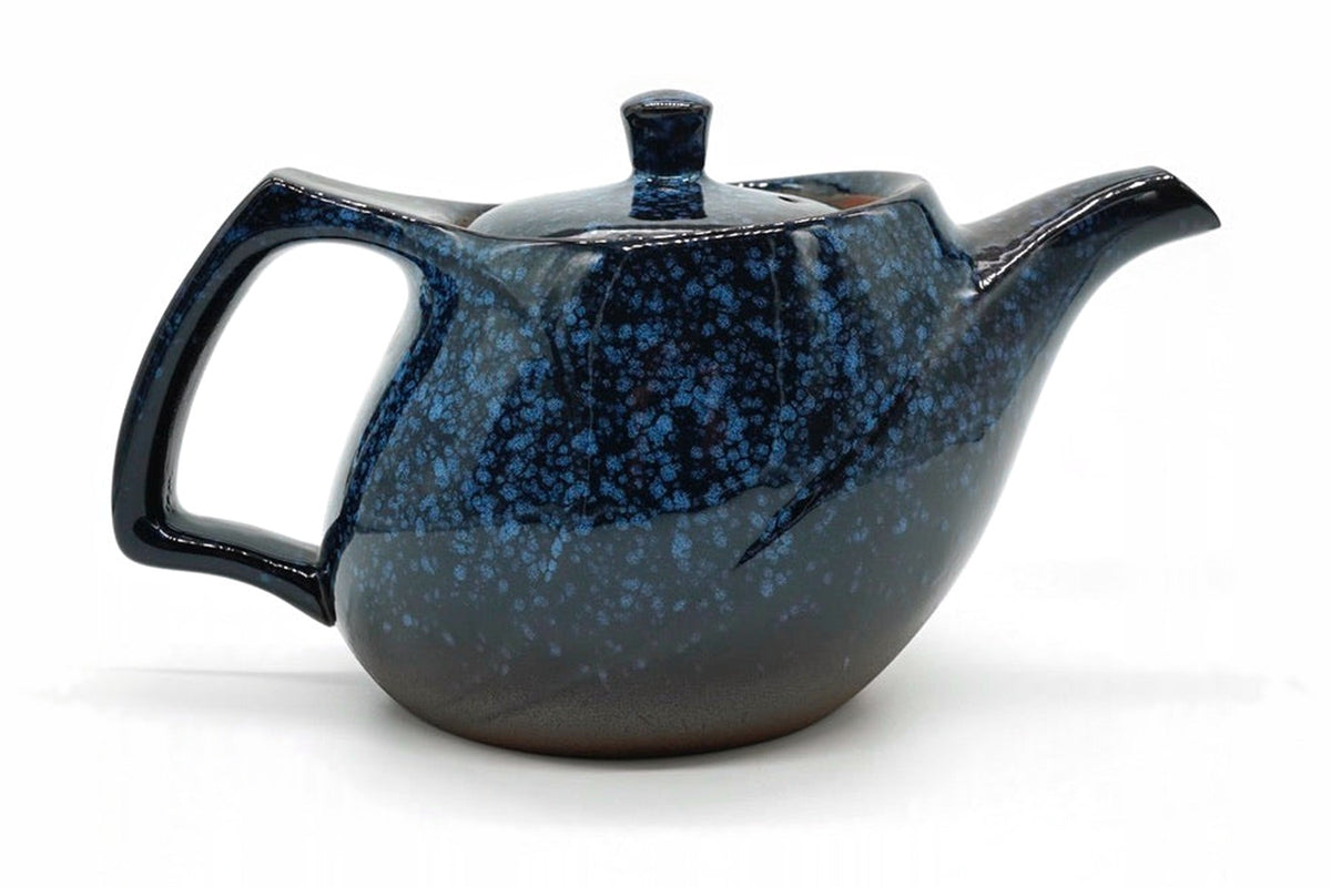 Seiko Kyusu, a deep blue speckled Tokoname teapot with a squared handle at the back, side view