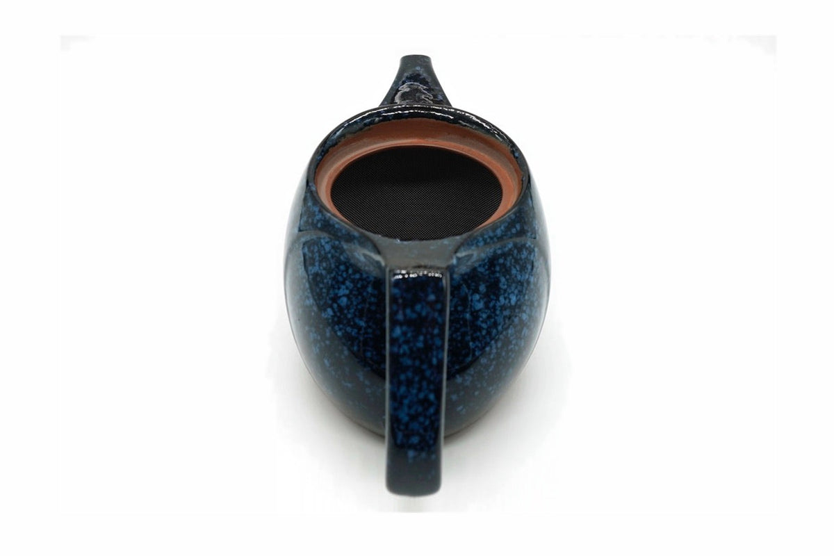 Seiko Kyusu with the lid off, the curved fine mesh over the spout opening inside