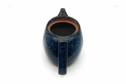Seiko Kyusu with the lid off, the curved fine mesh over the spout opening inside