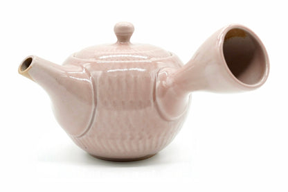 Sekimen Kyusu, a dusty-pink Tokoname teapot with rows of chattered marks, side view
