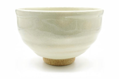 Shiro-Nagashi Chawan, a Mino ware matcha bowl in a pale ivory glaze with soft grey-green bands, front view