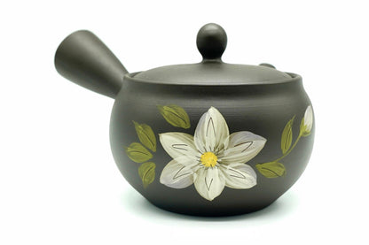 Shiroi Hana Kyusu, a dark Tokoname teapot hand-painted with one large white flower, side view