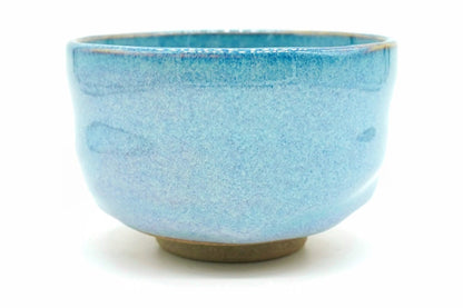 Sorairo Yunomi, a bowl-shaped teacup in a softly mottled pale sky-blue glaze with a bare brown foot