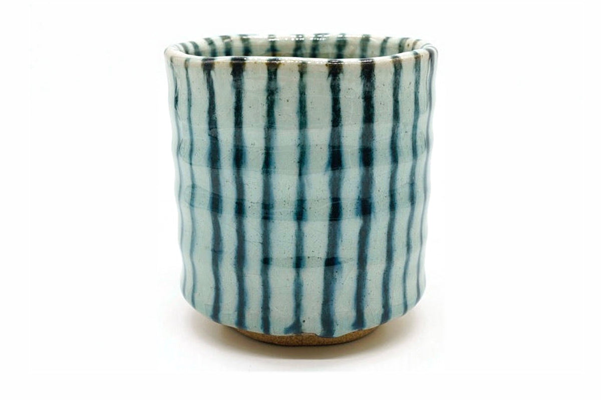 Sumo Yunomi, a tall pale blue-white Mino ware teacup with dark blue vertical stripes, front view