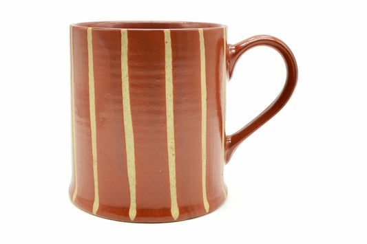 Tokusa Yunomi, a straight-sided Mino ware mug in red with cream vertical stripes and a glossy loop handle