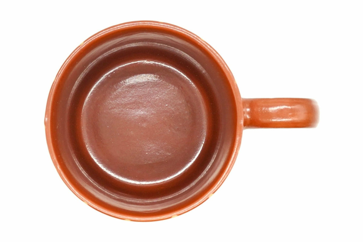 Tokusa Yunomi from above, the glossy red-brown inside and the loop handle on the right