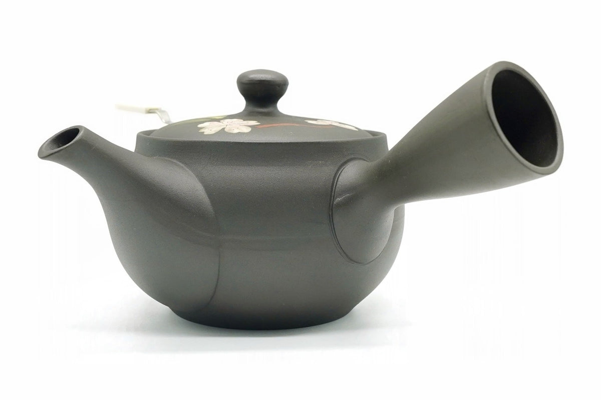 Back of the Yamazakura Kyusu, the plain dark charcoal body with the side handle on the right and a blossom on the lid
